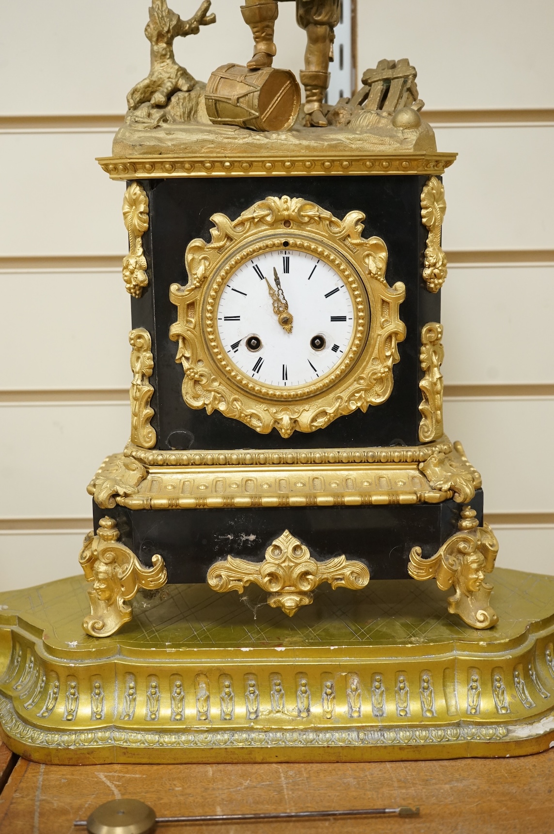 A 19th century French gilt metal mantel clock and stand, 56cm total